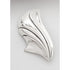 Silver brooch with a leaf-like design on a light gray background