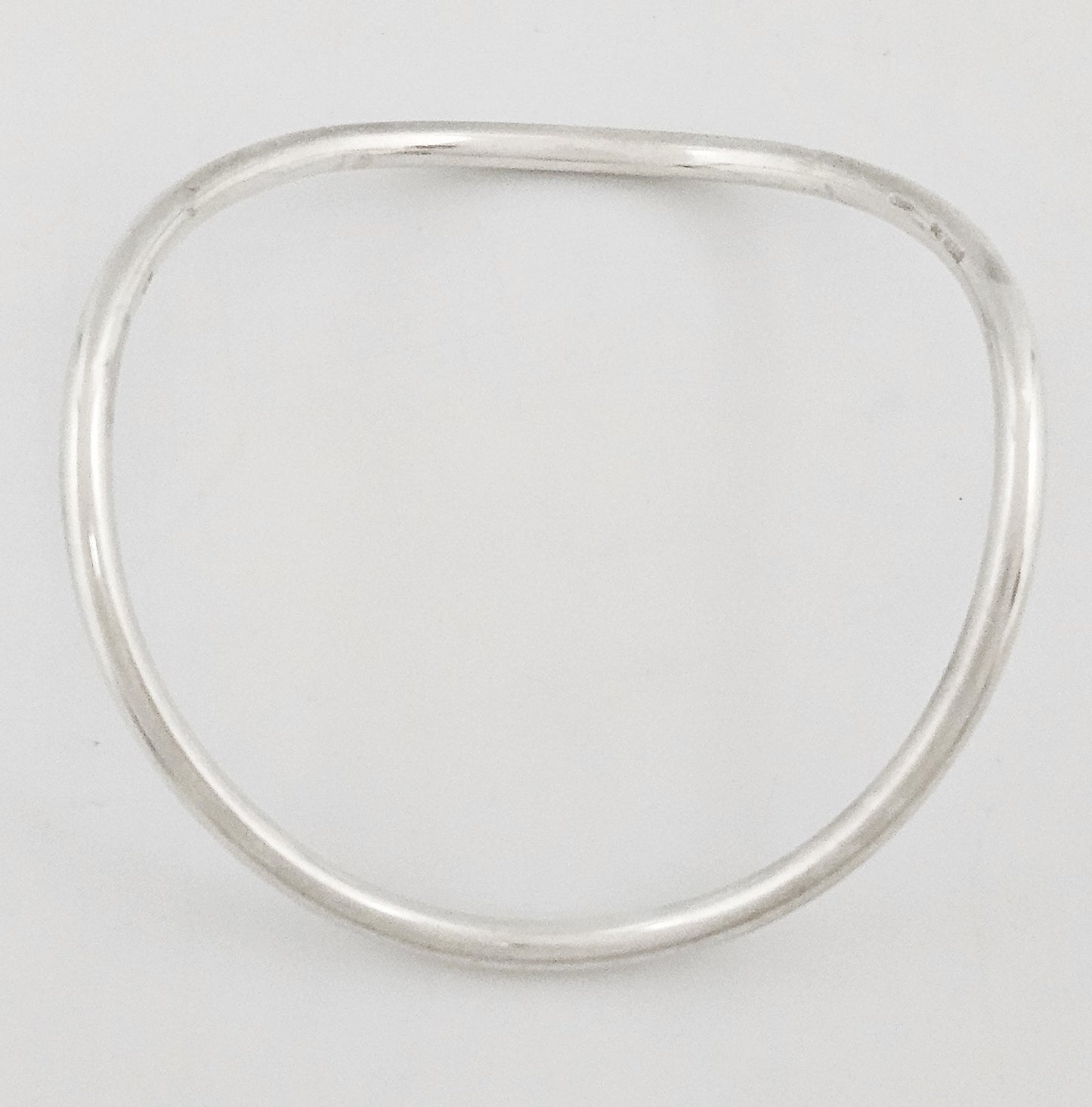 Betty Cooke sterling silver modernist Wavy Tubular Bangle Bracelet Circa 1960s, view 1 of 7