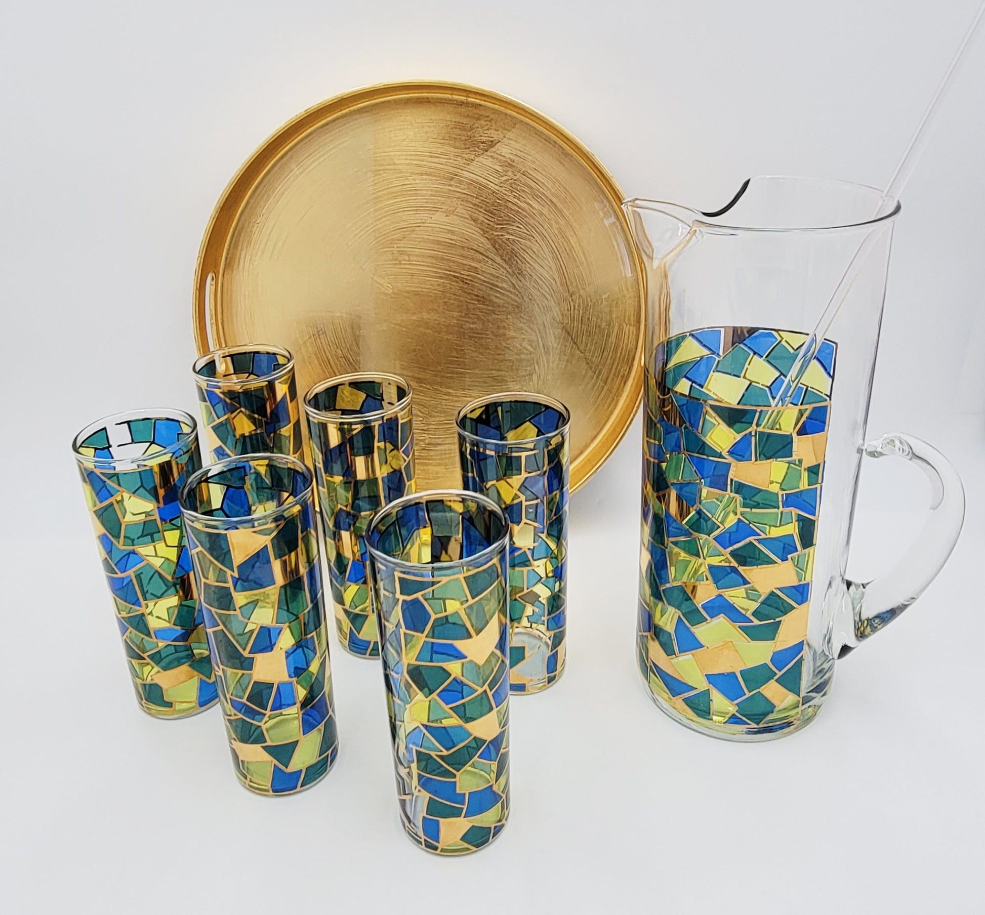 https://trendymcmhome.com/cdn/shop/files/mcm-barware-barware-mcm-tall-pitcher-with-6-matching-collins-glasses-and-metallic-gold-tray-set-39187176325335.jpg?v=1685651183&width=1946